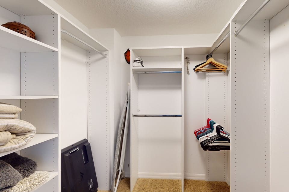 Large walk-in closet with ample shelving and hanging space, ideal for unpacking and staying organized during your beach stay. Plenty of room for luggage, resort wear, and seaside essentials.