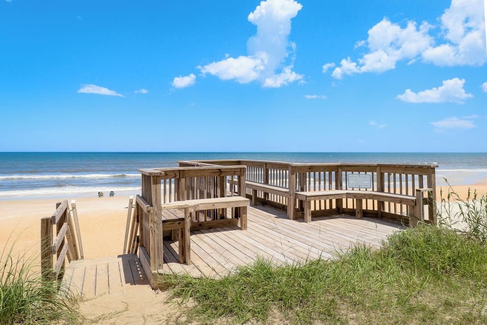 Enjoy direct access to the sandy shoreline from this oceanfront boardwalk. Relax, take in the views, and make the most of your beach stay with easy access to sun, surf, and sea breezes.