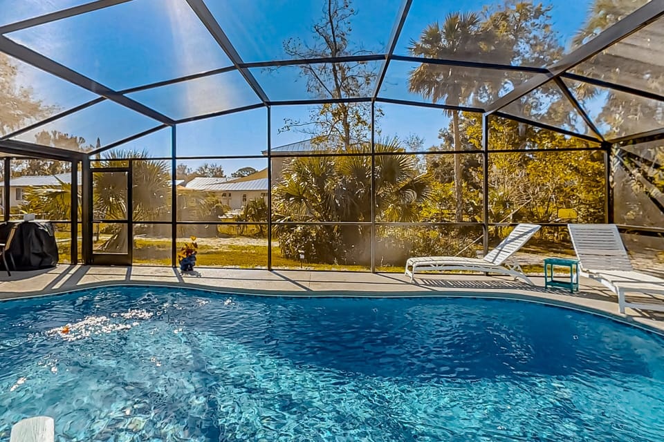 Relax in this bright, screened-in private pool oasis just minutes from the beach. Perfect for a refreshing dip after your coastal adventures—your ideal beach stay escape.