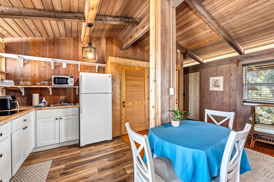 Sunlight spills across the counter and dining area, creating a warm, inviting space for family meals or snacks.