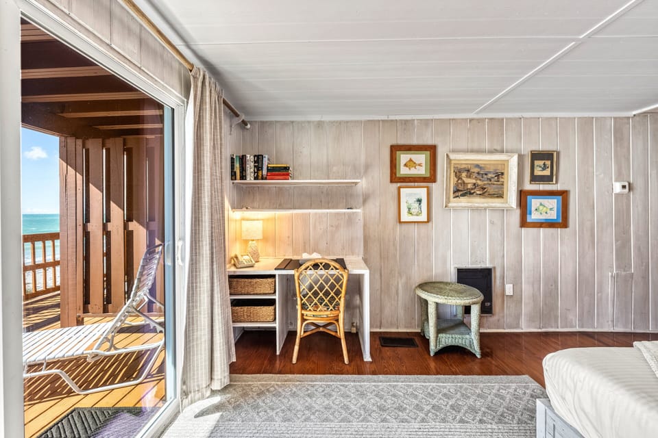 Sliding doors reveal the semi-private deck and sparkling Gulf beyond.