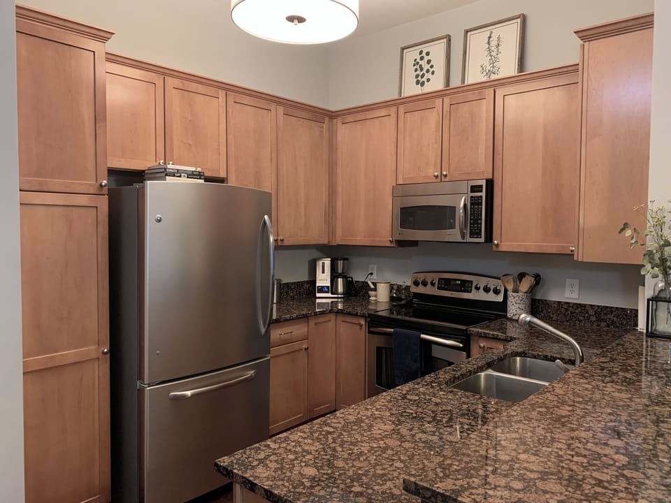 Kitchen with refrigerator, freezer, stove, oven, microwave and dishwasher