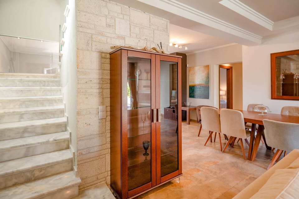 Majestic marble staircase to upper level