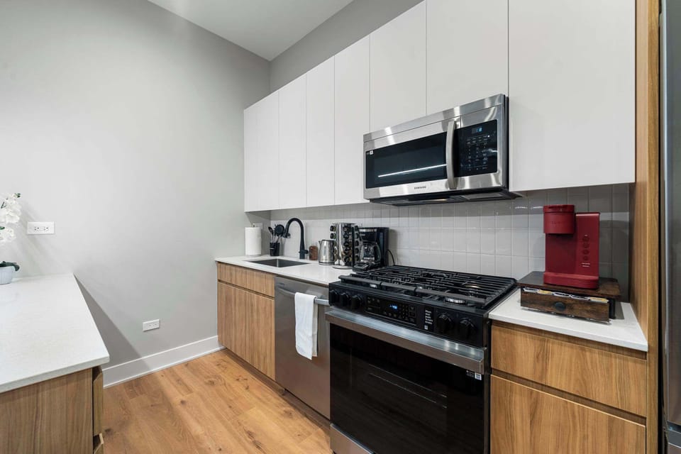 Sleek kitchen w/ modern appliances & plenty of counter space for home cooking