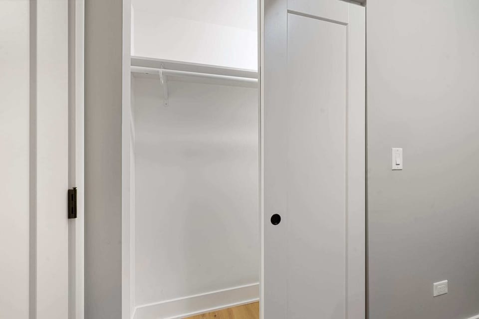 Simple closet area offering space to unpack & settle in