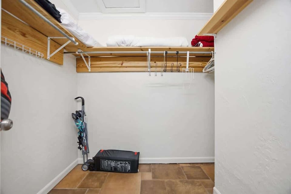 Spacious walk-in closet with plenty of shelving and storage.