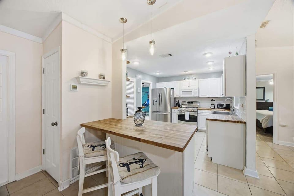 Bright kitchen with island seating and open layout.