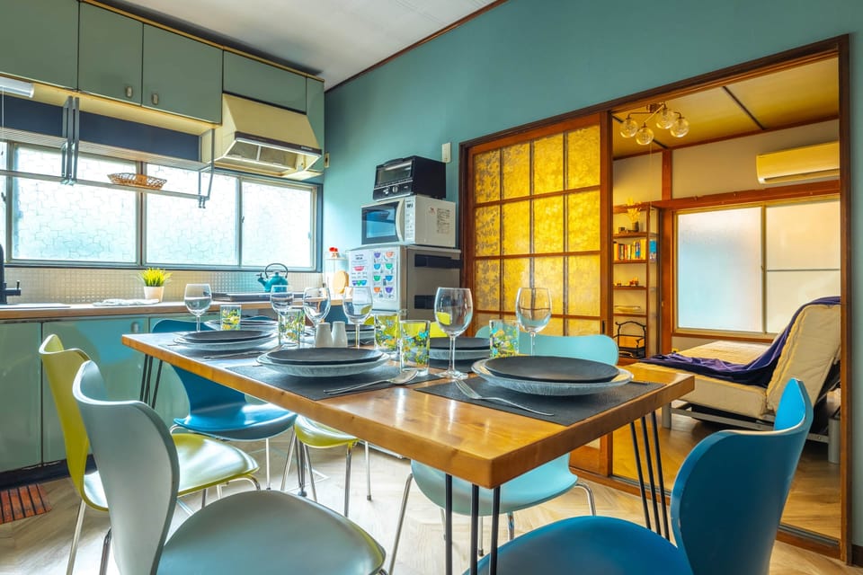 Enjoy family meals in a vibrant retro dining room with a seamless flow into the living spaces.