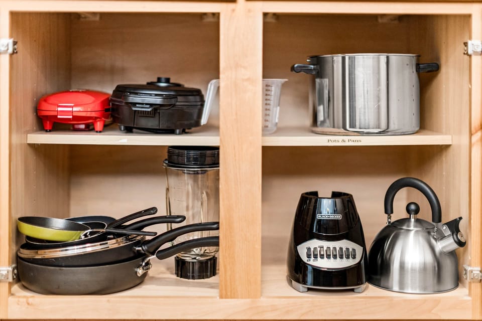 Fully stocked kitchen essentials—kettle, toaster, waffle maker, and more