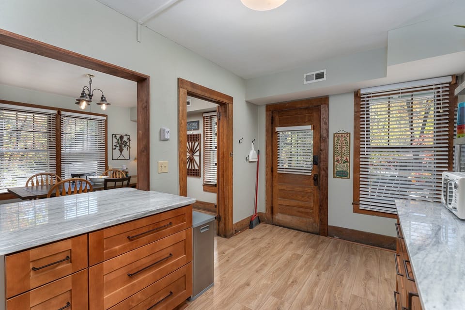 Fully equipped kitchen with gas range, dishwasher, and Keurig coffee maker