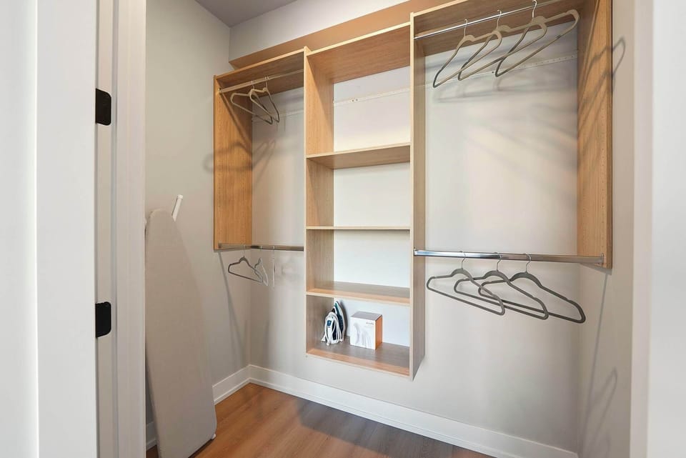 Open closet area w/ shelves & hanging space to stay organized.