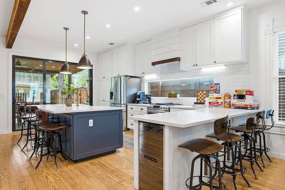 8 barstools offer seating indoors and the outdoor dining table offers seating for 8 as well.