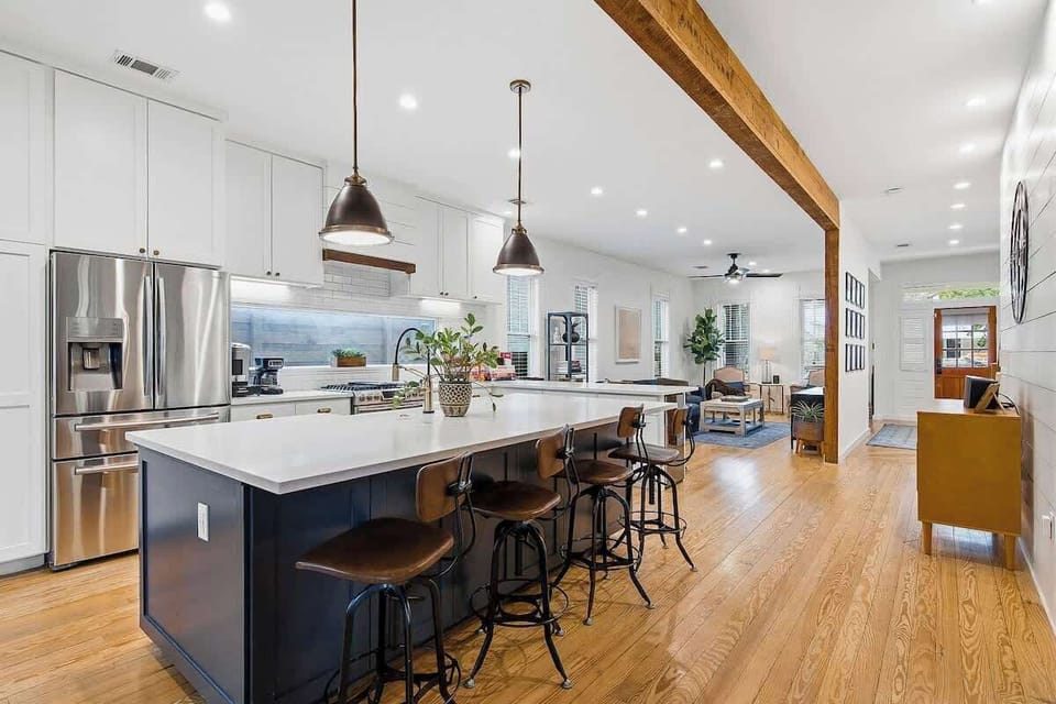 The kitchen is stocked with basic cookware, serving dishes, and appliances.