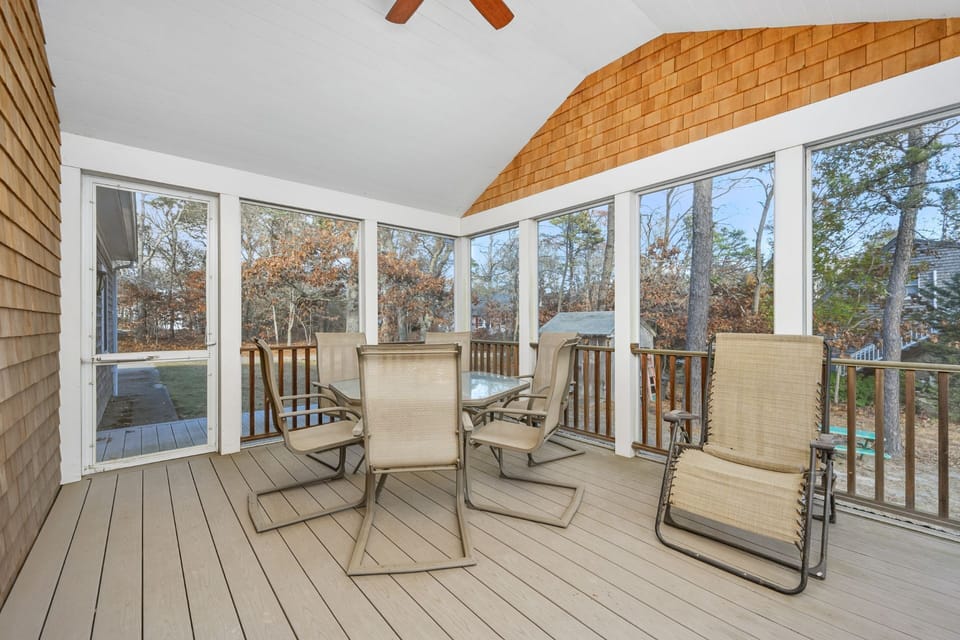 Screened-in back deck ideal for meals or relaxation