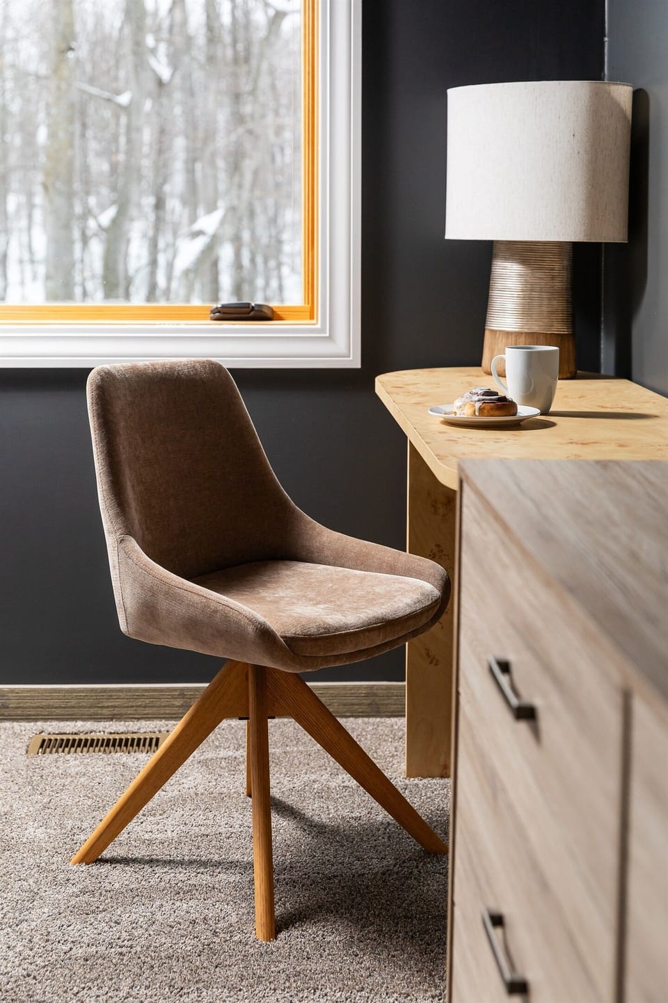 The work space in the master bedroom is a cozy spot to get some work done while enjoying the view of woods out back.