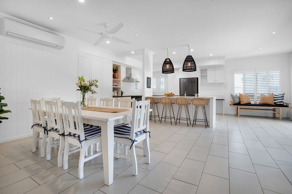 Open plan kitchen and dining area with breakfast bar
