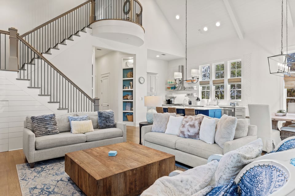 Open concept living area featuring a high ceiling and modern interior design.