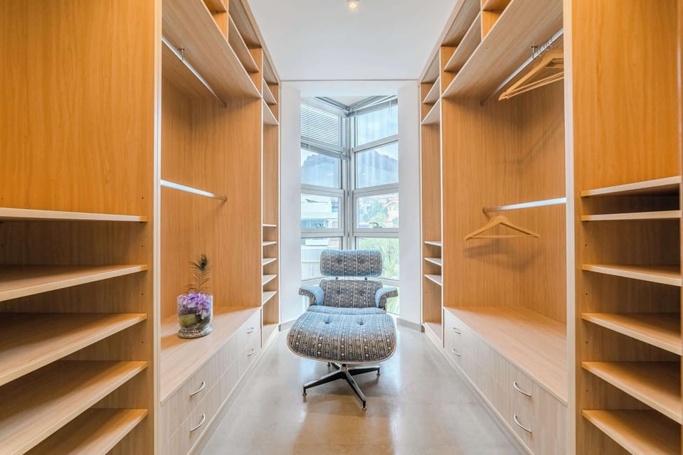 Spacious Walk-In Closet - Organize in Style with Ample Storage and Seating