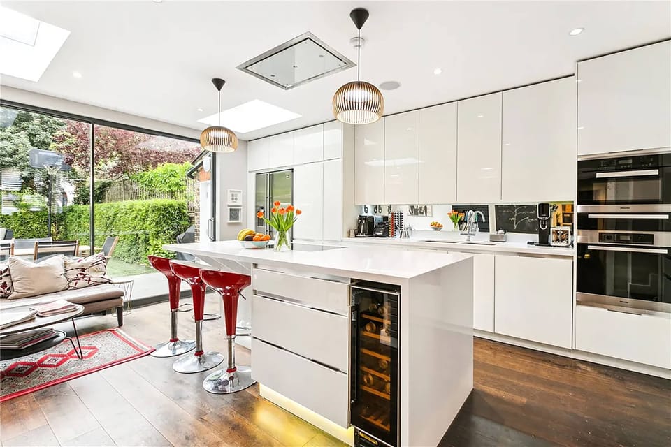Enjoy time together in the open-plan kitchen, complete with an island and views over the garden.