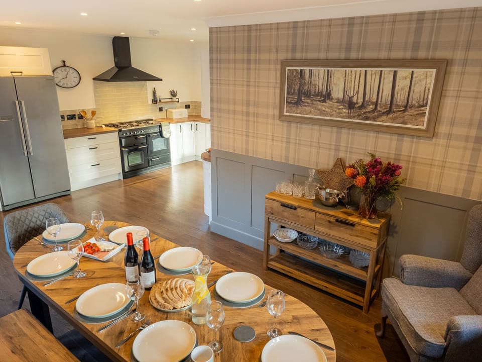 Another angle of the informal dining setting, highlighting the bright space and simple, comfortable decor.
