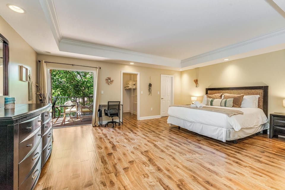 Spacious master bedroom with private access to balcony