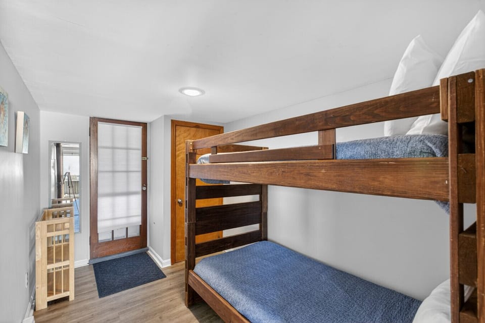 Bunk room with door to covered porch