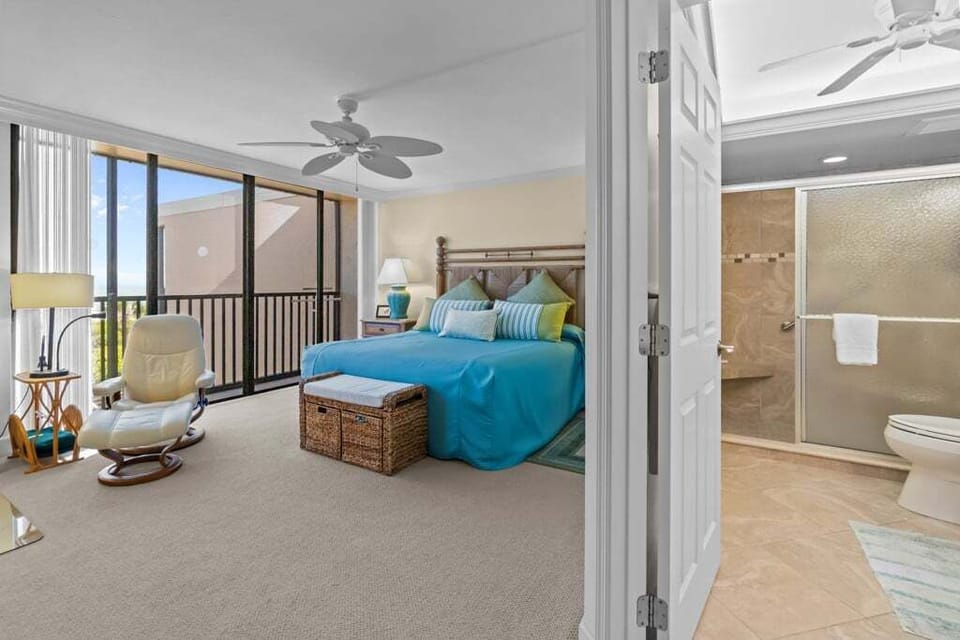 Primary bedroom with slider access to private screened lanai