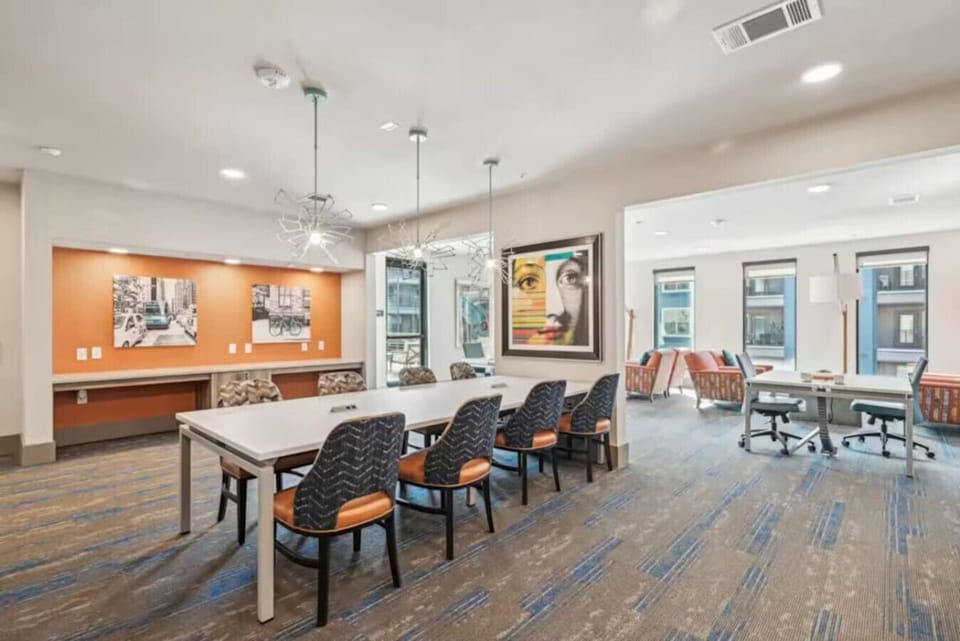 - Modern business center with conference table and designer lighting - Coworking lounge with high speed WiFi and creative workspace - Stylish meeting room ideal for remote work and collaboration
