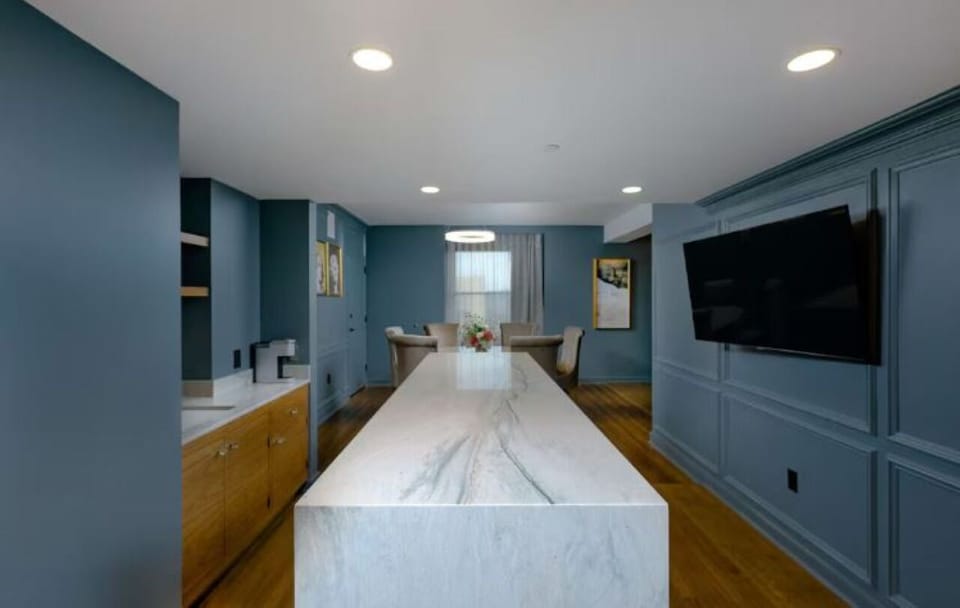 Gather around the oversized marble island for drinks and bites.