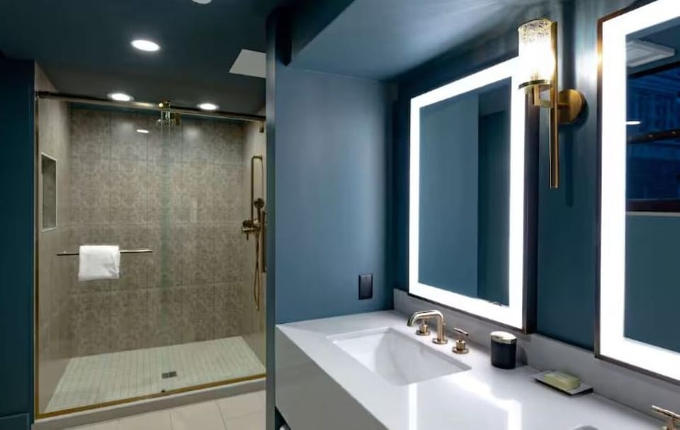 Refresh in the spa-like shower with glowing vanity mirrors.