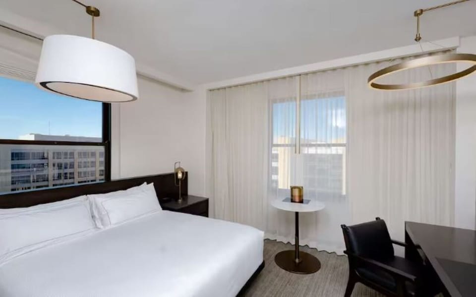 Wake up to sunshine streaming through airy floor-to-ceiling curtains.
