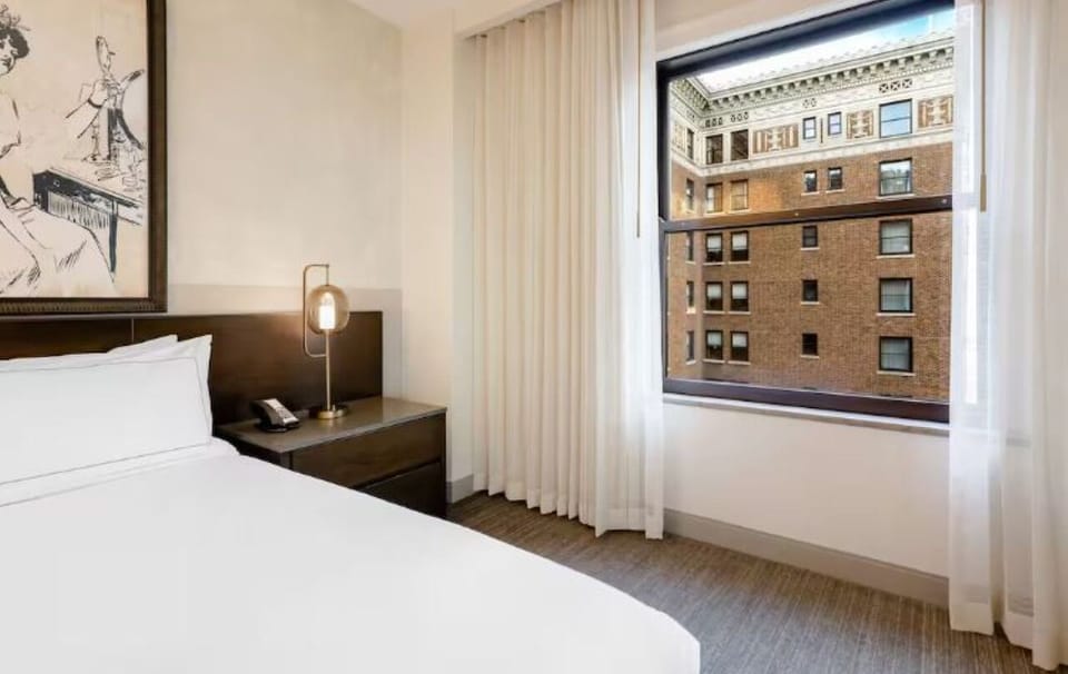 Sip morning coffee beside the window overlooking classic architecture.