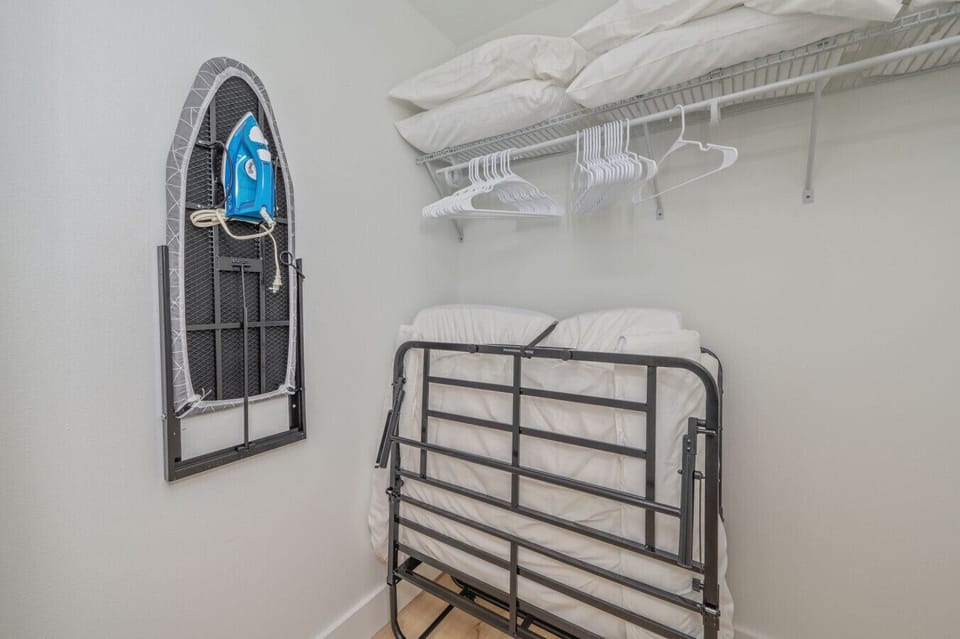 Designated space to hang clothes and iron with ease