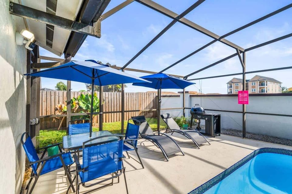 Unwind with loungers, shaded seating, and a BBQ grill for easy outdoor meals and family poolside hangouts.