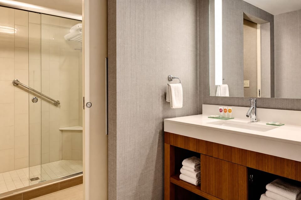Refresh in a sleek vanity bath with bright, spa-like lighting.