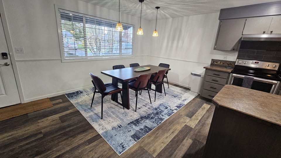 Added rugs.  
6 fit comfortably. 3 additional chairs available. 