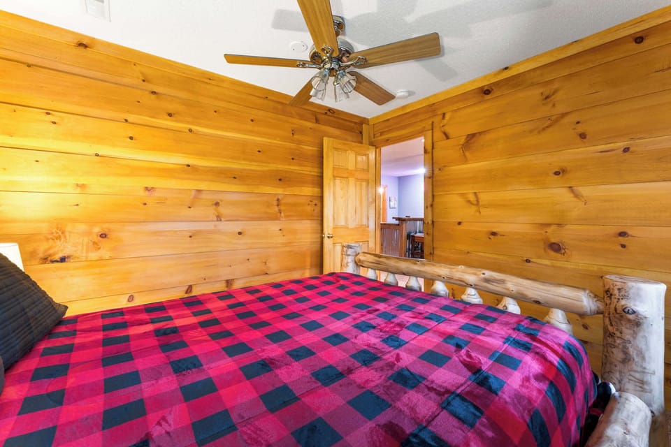 Private Queen bedroom with natural light and ceiling fan comfort.