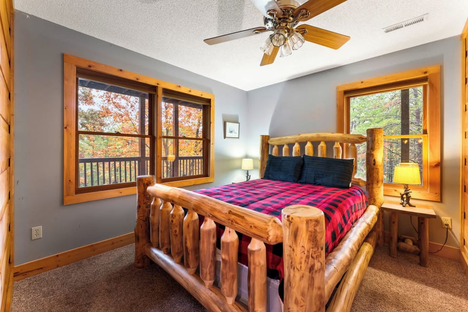 Private Queen bedroom with natural light and ceiling fan comfort.