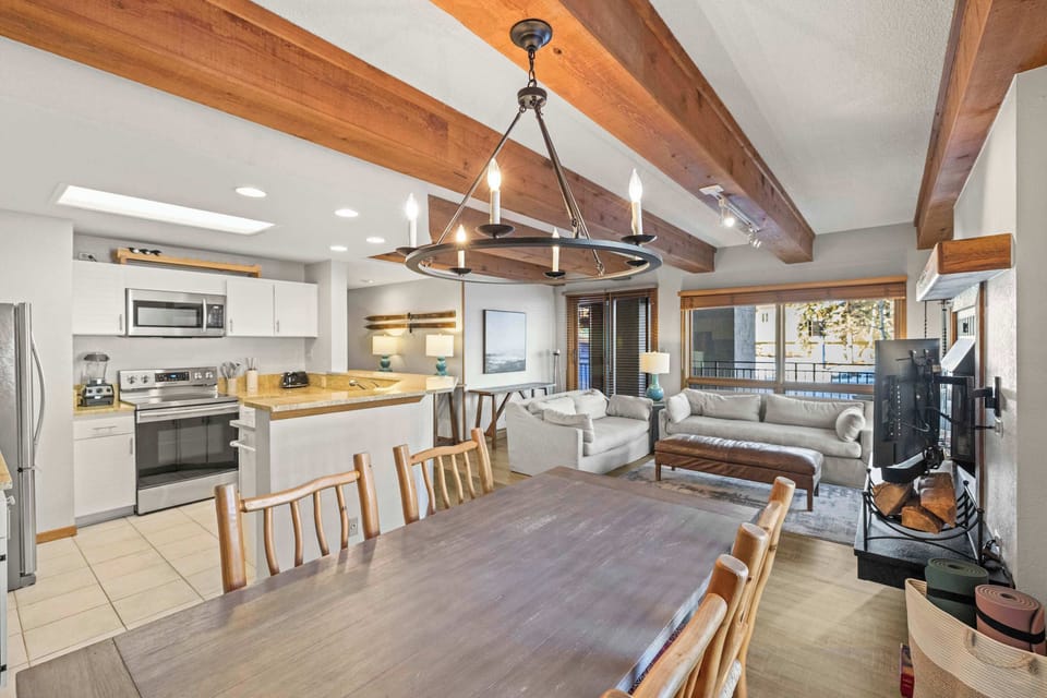 【Living + Mountain View】 Open layout, balcony slider behind you — that's the resort out the window. | @BookTraverse