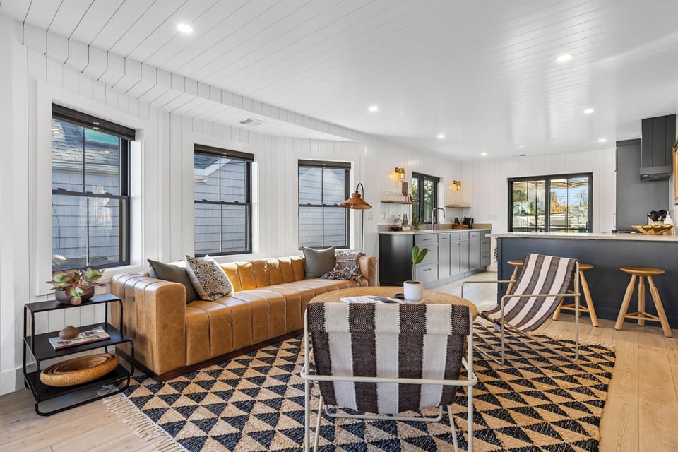 Modern living space with shiplap walls and ceilings