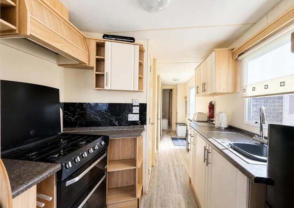 The kitchen with its fridge, oven, grill, hob and microwave has everything you will need to prepare meals for everyone. Make sure this is your first port of call in the morning for fresh coffee.