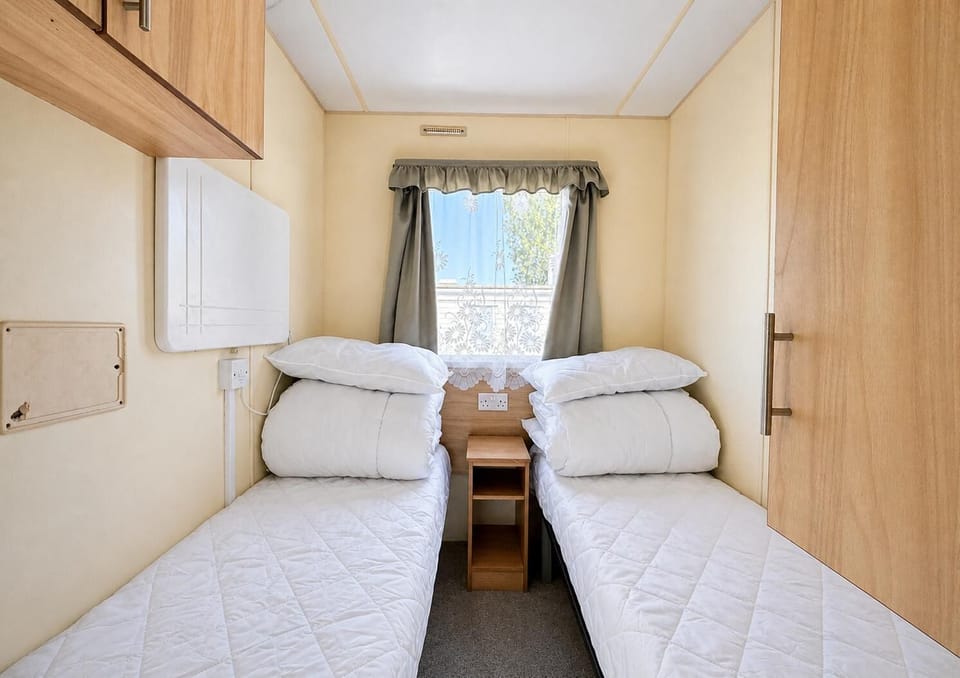 The second twin room is perfect if travelling with family members. They will appreciate having their own space in this Essex caravan. Somewhere to retreat to after a busy day on this Holiday Park.