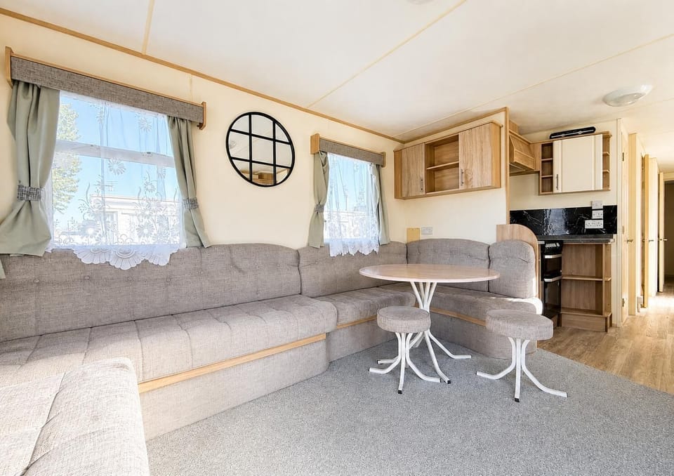 The dining table at this modern caravan seats four comfortably and is the perfect place to dish up dinner for the whole family. Once dinner is done get the board games out and enjoy a fun filled family night in together in Essex.