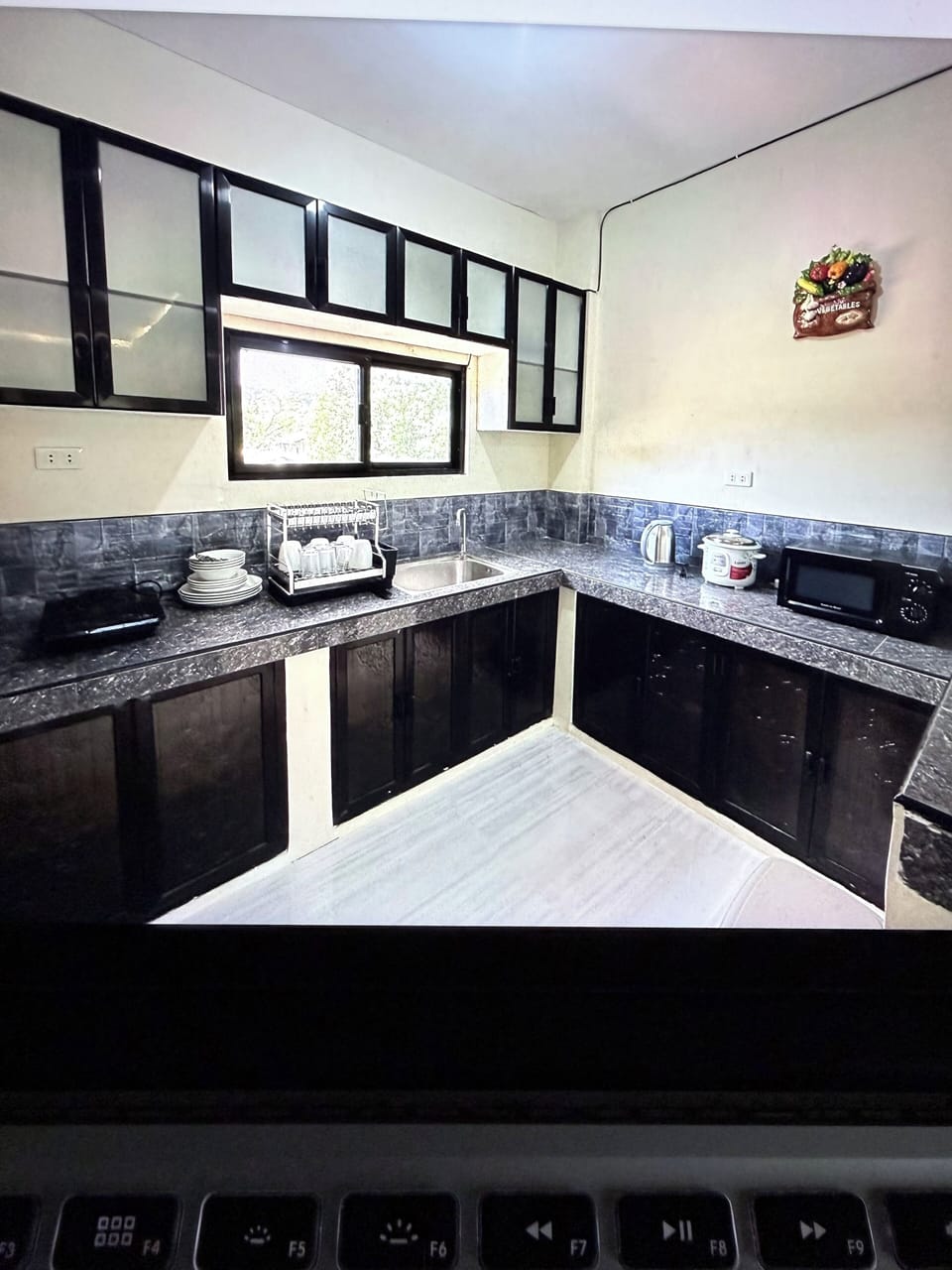 Furnished kitchen with all basic amenities .