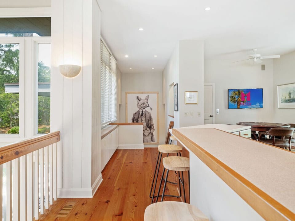 Staircase Leading to Sunlit Living Spaces & Oceanview Suites