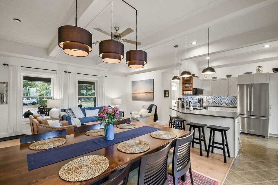 There is a generous amount of prep space that faces out into the living room and dining room. There are 4 bar stools that tuck under the counter.
