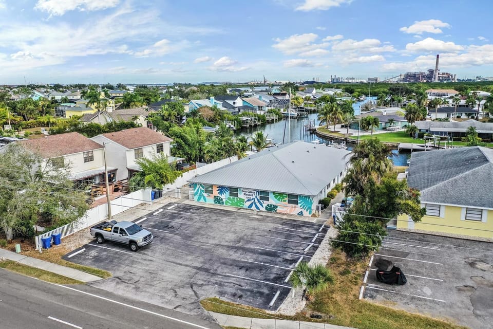 Colorful coastal property with ample parking and direct canal access, set in a peaceful waterfront neighborhood. Ideal for boating lovers and anyone seeking a relaxed, scenic getaway.