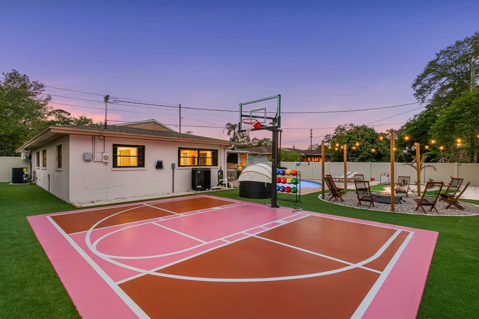 Serve, shoot, and play on your private pickleball and basketball court.