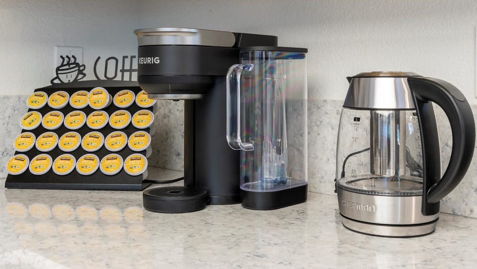 The kitchen coffee station includes a Keurig, electric kettle, and a variety of pods—making mornings easy and convenient during your stay