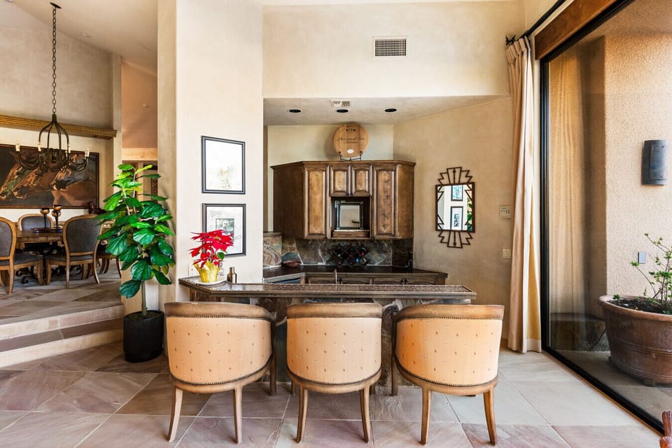 Warm, refined interiors with a stylish bar and seamless indoor–outdoor flow—perfect for relaxed evenings and effortless entertaining.